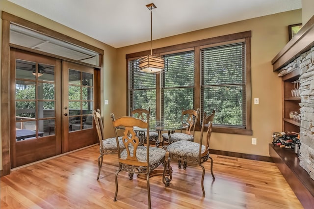 860 Prairie Meadows Dr, Hudson, WI 54016 - dining room featuring healthy amount of natural light, french doors, and wood finished floors
