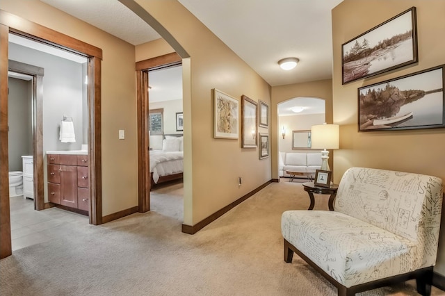 860 Prairie Meadows Dr, Hudson, WI 54016 - living area with arched walkways and light colored carpet