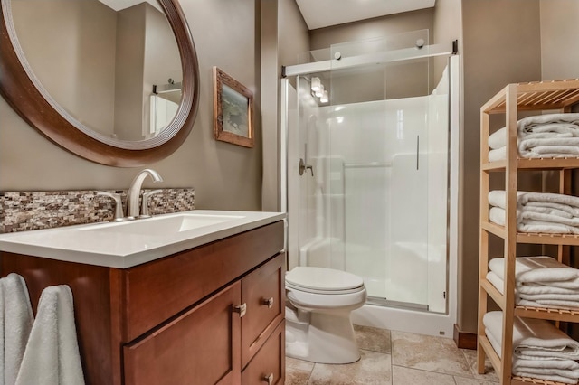 860 Prairie Meadows Dr, Hudson, WI 54016 - full bath featuring a stall shower, vanity, decorative backsplash, and stone finish flooring