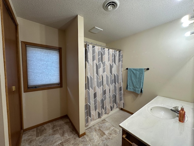 121 Park St, Luverne, MN 56156 - full bath with vanity, a shower with shower curtain, and a textured ceiling