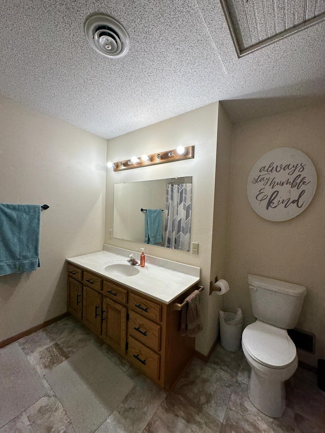 121 Park St, Luverne, MN 56156 - bathroom featuring vanity and a textured ceiling