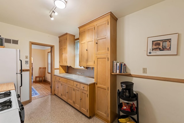 5924 10th Ave S, Minneapolis, MN 55417 - kitchen with white appliances, light countertops, and light brown cabinetry