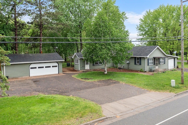 27900 Old Towne Rd, Chisago City, MN 55013 - single story home with an outdoor structure, a detached garage, a front yard, and a shingled roof