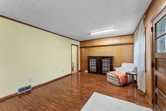 27900 Old Towne Rd, Chisago City, MN 55013 - sitting room with wood finished floors, crown molding, wood walls, and french doors