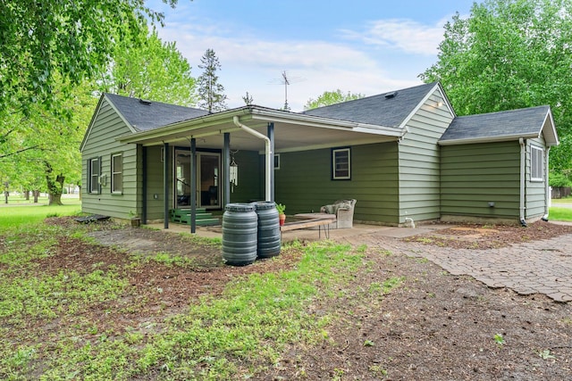 27900 Old Towne Rd, Chisago City, MN 55013 - rear view of house featuring a patio area and a shingled roof