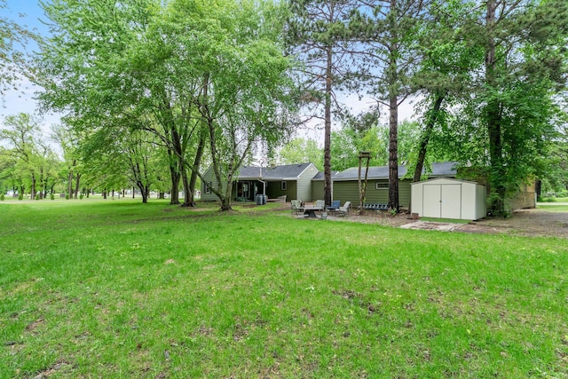 27900 Old Towne Rd, Chisago City, MN 55013 - view of grassy yard with a storage unit