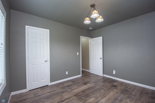 1514 1st Ave S, Fargo, ND 58103 - unfurnished bedroom featuring wood finished floors