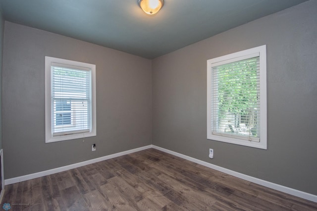 1514 1st Ave S, Fargo, ND 58103 - unfurnished room with dark wood finished floors and baseboards