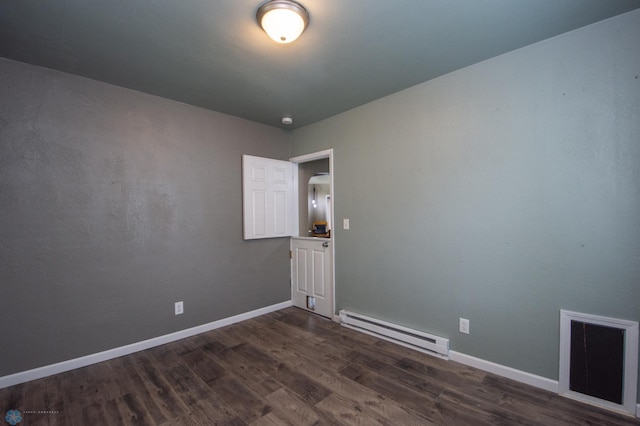 1514 1st Ave S, Fargo, ND 58103 - empty room with baseboard heating and dark wood finished floors