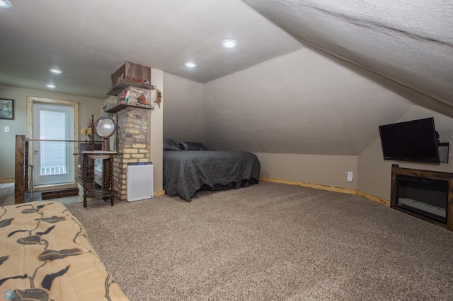 1514 1st Ave S, Fargo, ND 58103 - carpeted bedroom featuring a glass covered fireplace, vaulted ceiling, and recessed lighting