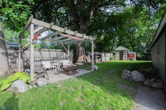 1514 1st Ave S, Fargo, ND 58103 - fenced backyard featuring a patio area, a fire pit, a storage shed, and a pergola
