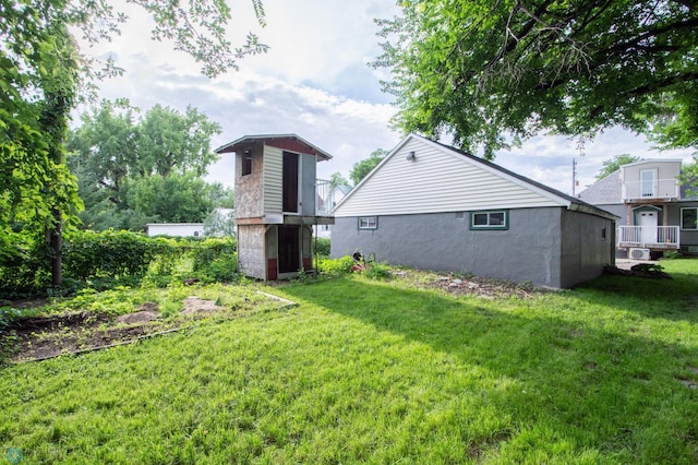 1514 1st Ave S, Fargo, ND 58103 - back of house featuring a yard and stucco siding