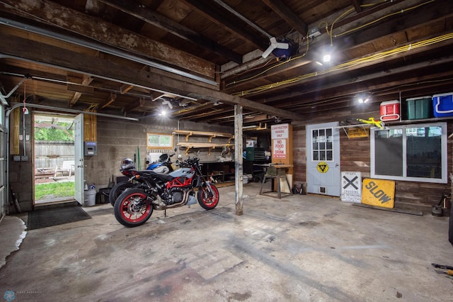 1514 1st Ave S, Fargo, ND 58103 - garage featuring concrete block wall and wood walls