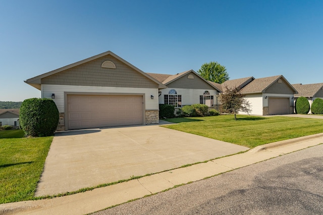 4540 Prairie View Pl NW, Rochester, MN 55901 - ranch-style home featuring a front lawn, a garage, concrete driveway, and stone siding