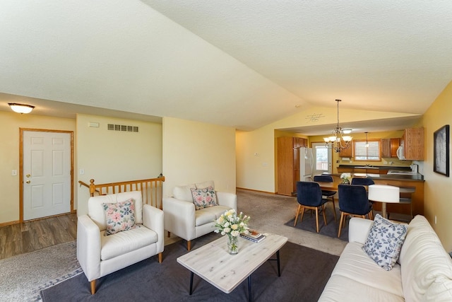 4540 Prairie View Pl NW, Rochester, MN 55901 - living area featuring a chandelier, lofted ceiling, and carpet