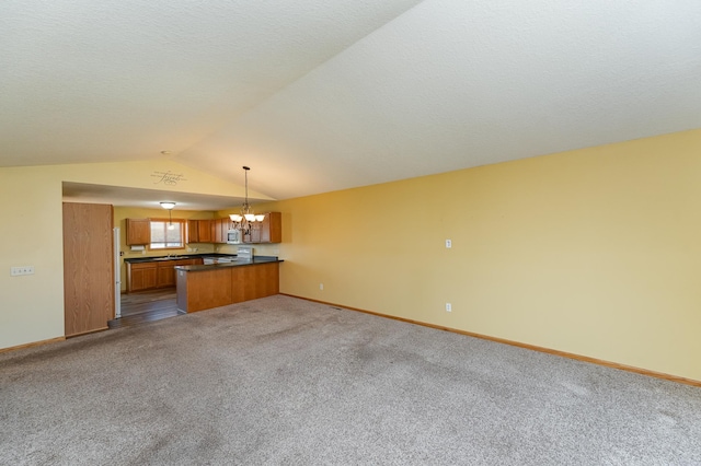 4540 Prairie View Pl NW, Rochester, MN 55901 - unfurnished living room featuring a chandelier, carpet flooring, and vaulted ceiling