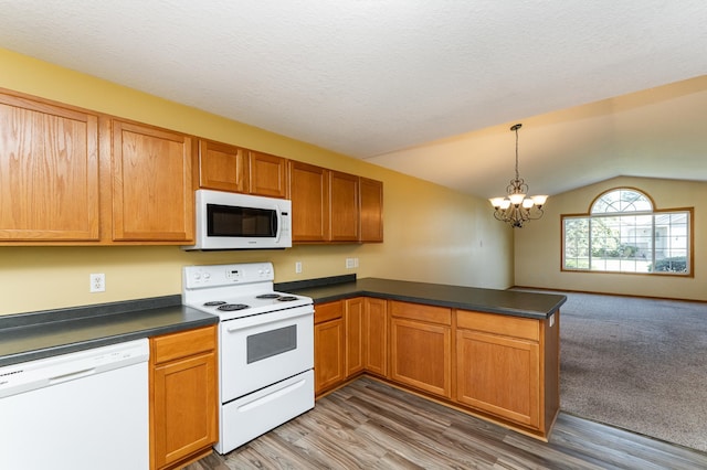 4540 Prairie View Pl NW, Rochester, MN 55901 - kitchen with white appliances, lofted ceiling, a peninsula, dark countertops, and a chandelier