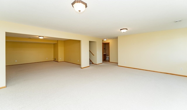 4540 Prairie View Pl NW, Rochester, MN 55901 - spare room with light carpet, stairs, and a smoke detector