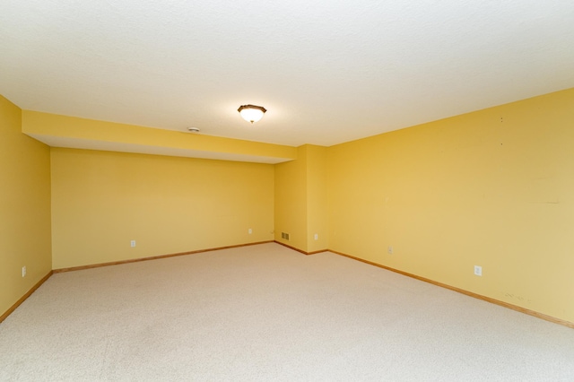 4540 Prairie View Pl NW, Rochester, MN 55901 - spare room featuring light carpet and baseboards