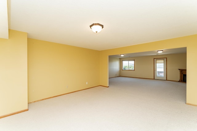 4540 Prairie View Pl NW, Rochester, MN 55901 - empty room with light colored carpet and a fireplace