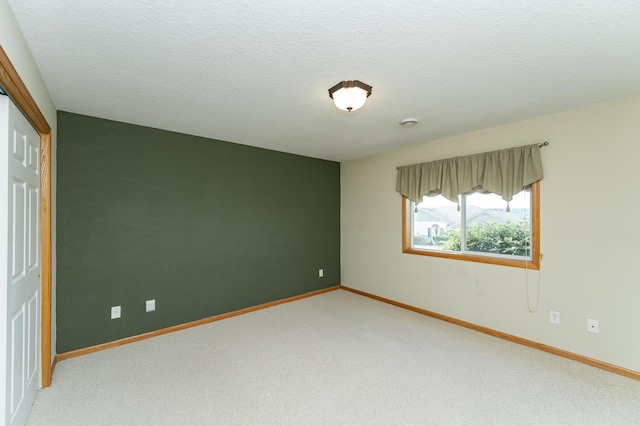 4540 Prairie View Pl NW, Rochester, MN 55901 - unfurnished bedroom with carpet, a closet, and a textured ceiling