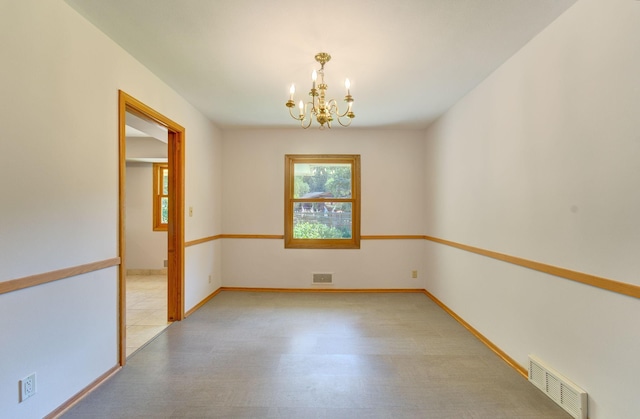 1636 9th Ave NE, Rochester, MN 55906 - empty room with a chandelier, plenty of natural light, and light wood-style floors
