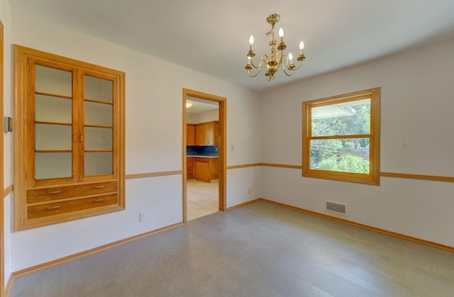 1636 9th Ave NE, Rochester, MN 55906 - unfurnished room with a chandelier and wood finished floors