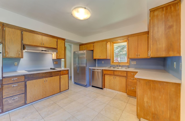 1636 9th Ave NE, Rochester, MN 55906 - kitchen featuring stainless steel appliances, under cabinet range hood, light countertops, and brown cabinetry