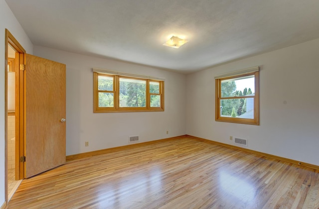 1636 9th Ave NE, Rochester, MN 55906 - unfurnished bedroom with light wood-style flooring