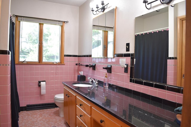 16014 240th St, Cold Spring, MN 56320 - bathroom featuring vanity, plenty of natural light, a wainscoted wall, a shower with curtain, and tile walls