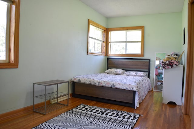 16014 240th St, Cold Spring, MN 56320 - bedroom featuring wood finished floors and baseboards
