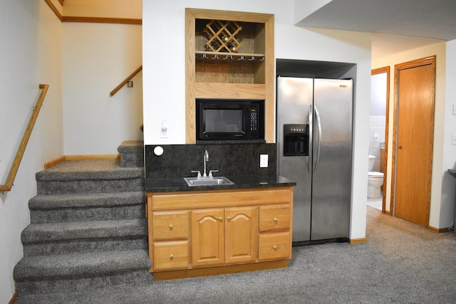 16014 240th St, Cold Spring, MN 56320 - kitchen with black microwave, stainless steel fridge, open shelves, carpet flooring, and decorative backsplash