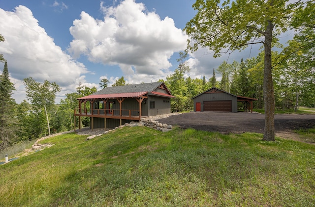 2018 County 5 NW, Hackensack, MN 56452 - view of front facade with a garage and an outbuilding
