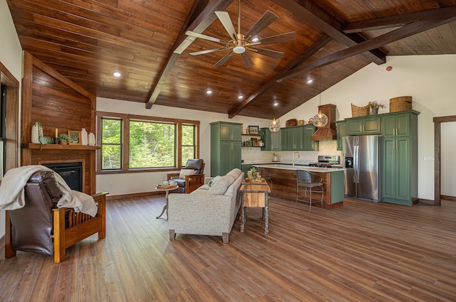 2018 County 5 NW, Hackensack, MN 56452 - living room with dark wood-style flooring, a ceiling fan, wooden ceiling, and a glass covered fireplace
