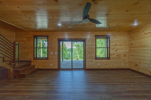2018 County 5 NW, Hackensack, MN 56452 - unfurnished living room with wood ceiling, stairs, wood finished floors, wooden walls, and a ceiling fan