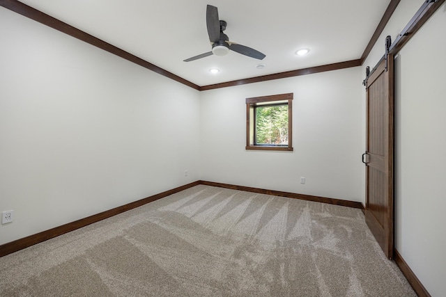 2018 County 5 NW, Hackensack, MN 56452 - unfurnished bedroom featuring a barn door, carpet flooring, recessed lighting, crown molding, and a ceiling fan