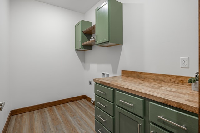 2018 County 5 NW, Hackensack, MN 56452 - laundry room with hookup for an electric dryer, cabinet space, light wood-style floors, and washer hookup