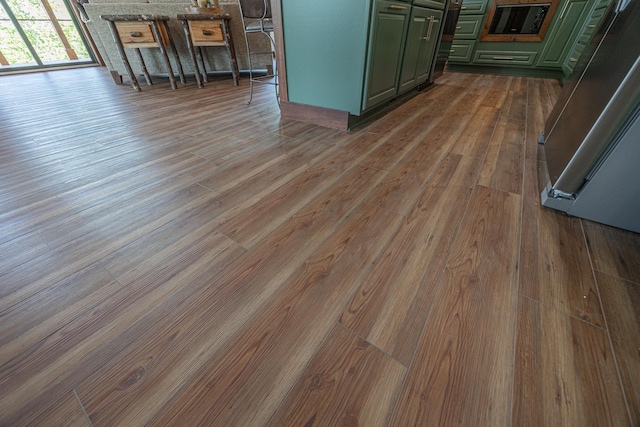 2018 County 5 NW, Hackensack, MN 56452 - detailed view of green cabinetry and dark wood-style floors
