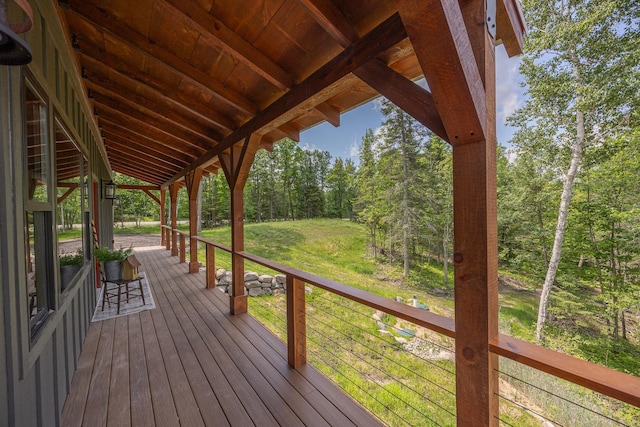 2018 County 5 NW, Hackensack, MN 56452 - wooden deck featuring a lawn and a view of trees