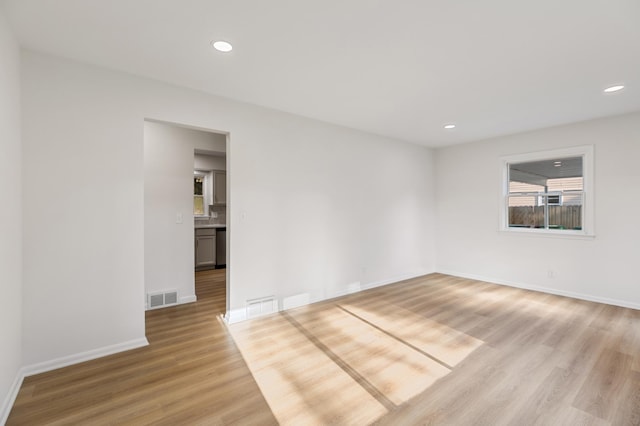 8517 Columbus Ave S, Bloomington, MN 55420 - empty room with light wood-type flooring and recessed lighting