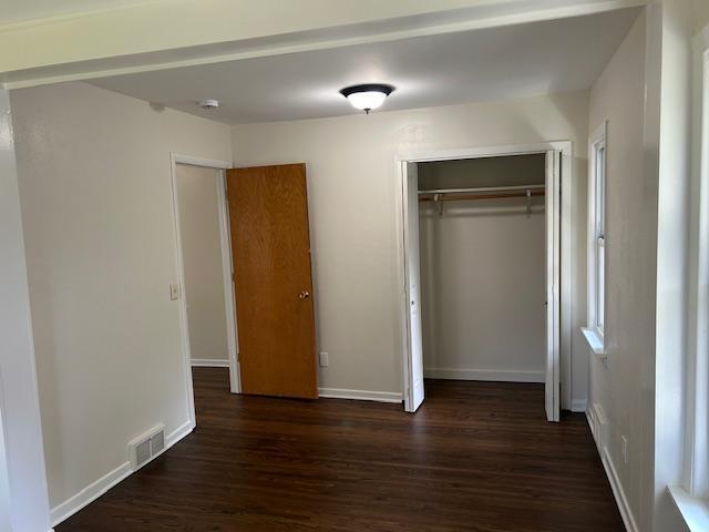 1464 Sheldon St, Saint Paul, MN 55108 - unfurnished bedroom featuring dark wood-style floors and a closet