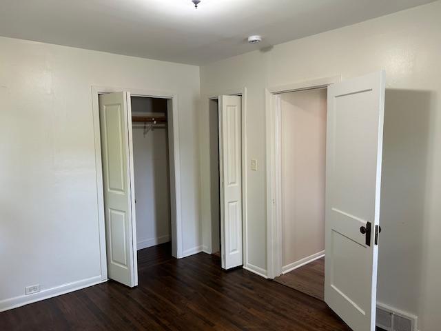 1464 Sheldon St, Saint Paul, MN 55108 - unfurnished bedroom with dark wood-style floors and a closet