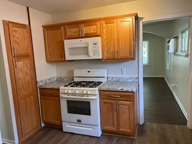 1464 Sheldon St, Saint Paul, MN 55108 - kitchen with white appliances, dark wood finished floors, and brown cabinets