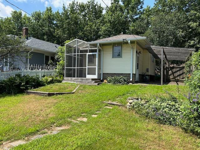 1464 Sheldon St, Saint Paul, MN 55108 - rear view of house featuring a carport and entry steps