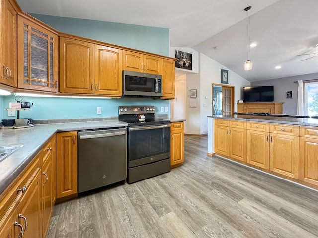 48285 229th Ave, Clearbrook, MN 56634 - kitchen featuring stainless steel appliances, vaulted ceiling, light wood-type flooring, glass insert cabinets, and brown cabinetry