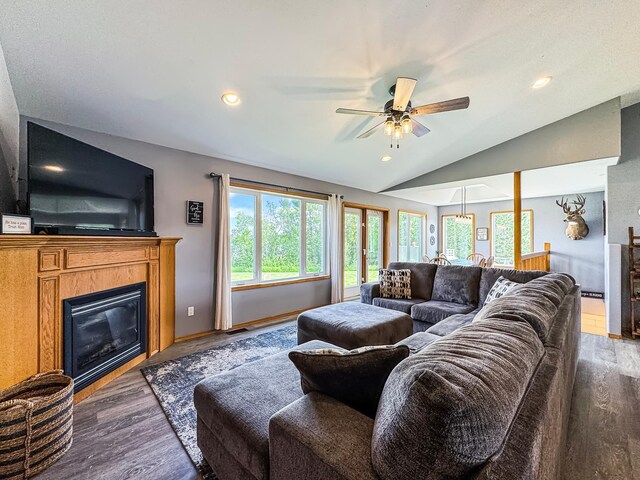 48285 229th Ave, Clearbrook, MN 56634 - living room with a glass covered fireplace, a ceiling fan, wood finished floors, lofted ceiling, and recessed lighting