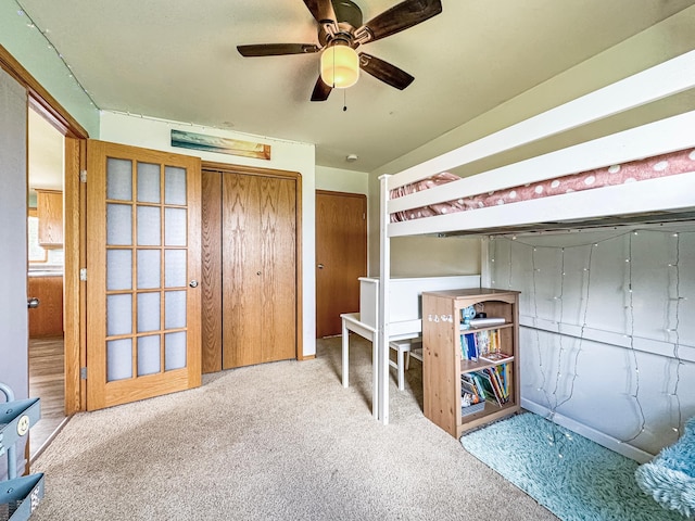 48285 229th Ave, Clearbrook, MN 56634 - unfurnished bedroom with carpet flooring, ceiling fan, and two closets