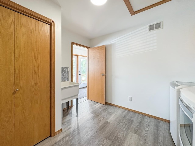 48285 229th Ave, Clearbrook, MN 56634 - laundry area with separate washer and dryer and light wood-style flooring