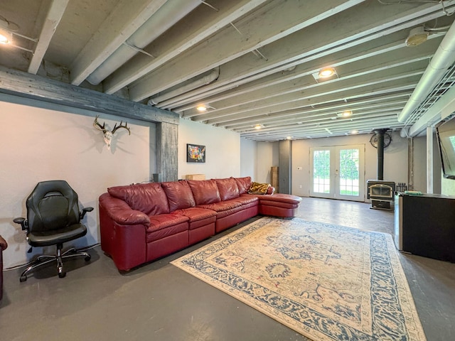 48285 229th Ave, Clearbrook, MN 56634 - living area with a wood stove and concrete floors