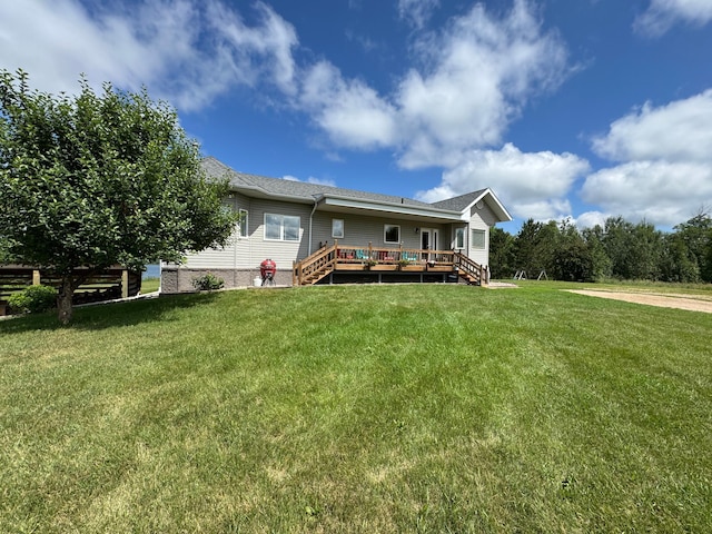 48285 229th Ave, Clearbrook, MN 56634 - rear view of house with a wooden deck, stairs, and a lawn